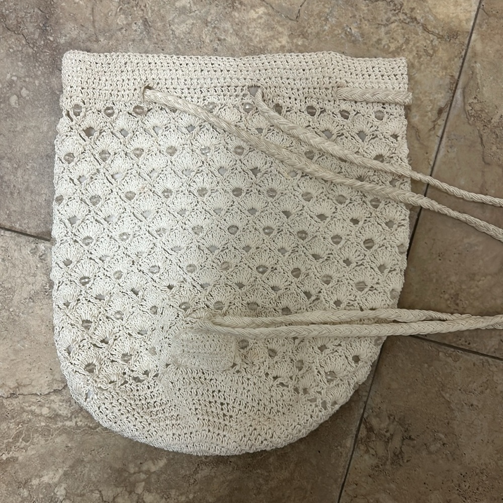 Adorable beaded bag can carry as back pack or over shoulder.